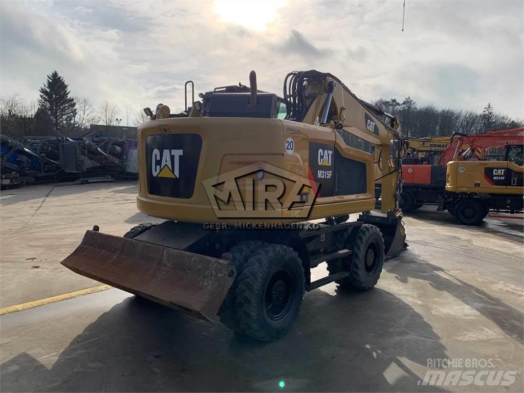 CAT M315 F Pelle sur pneus