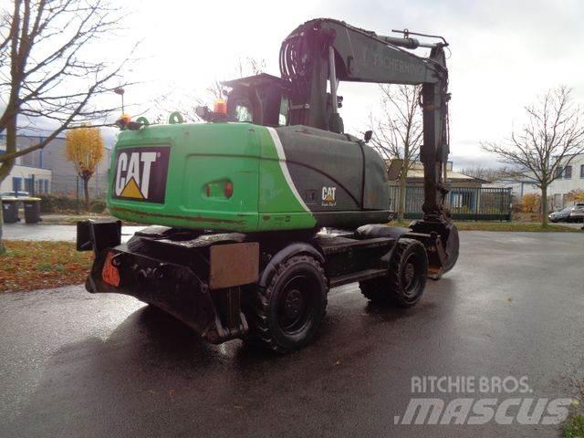 CAT M315 D Pelle sur pneus