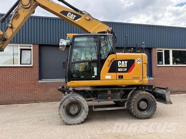 CAT M317 F Pelle sur pneus