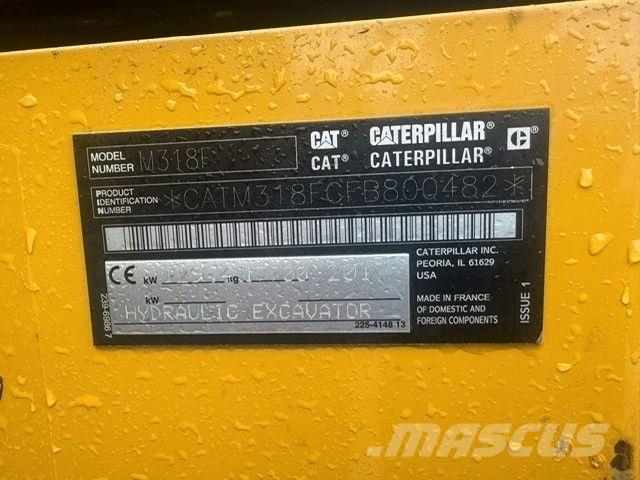 CAT M318F Pelle sur pneus