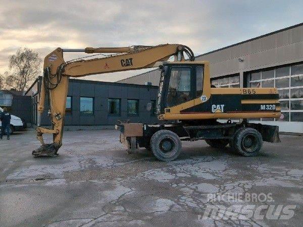 CAT M320 Pelle sur pneus