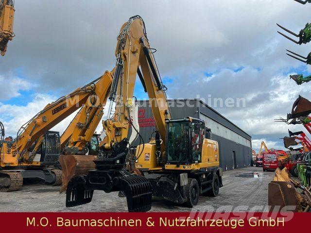 CAT MH 3022 Pelle sur pneus