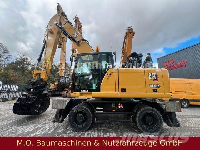 CAT MH 3022 Pelle sur pneus
