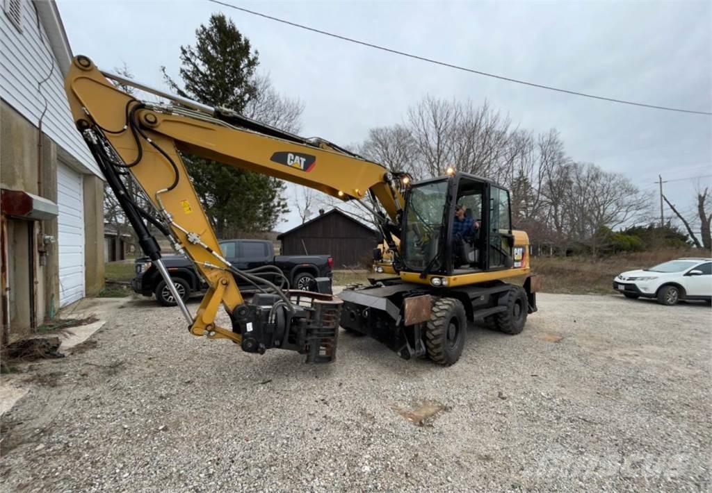 CAT M313D Pelle sur pneus