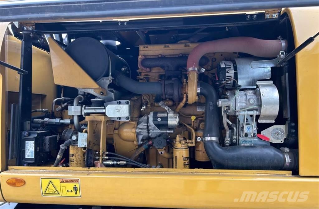 CAT M313D Pelle sur pneus