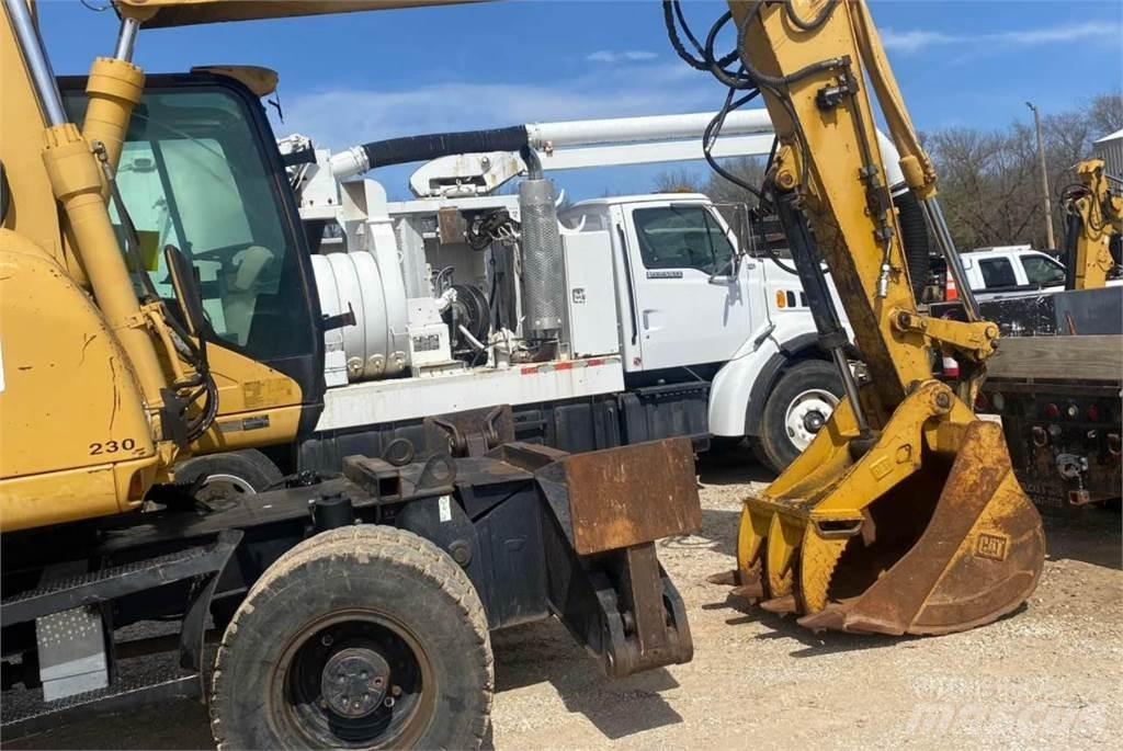 CAT M316C Pelle sur pneus