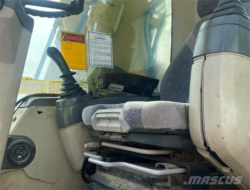 CAT M316C Pelle sur pneus