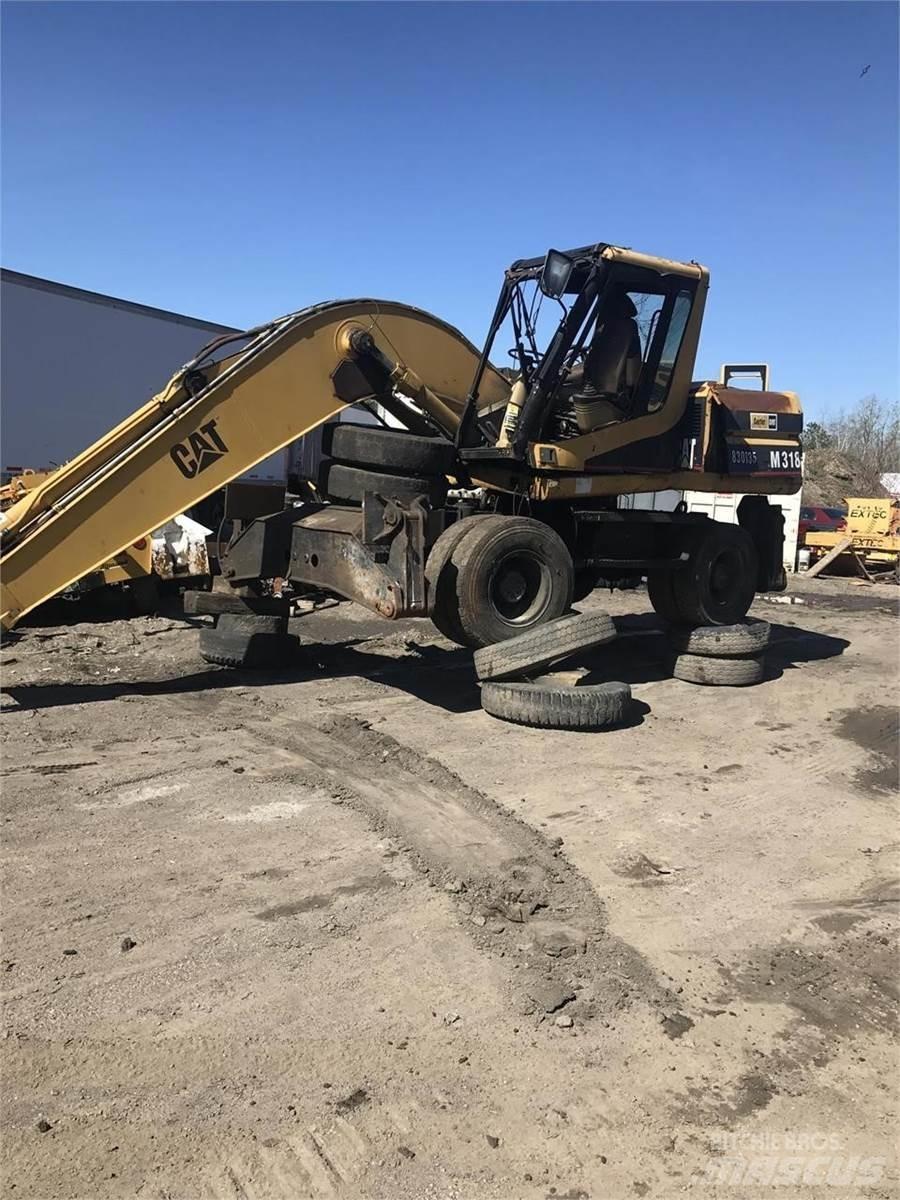 CAT M318 Pelle sur pneus