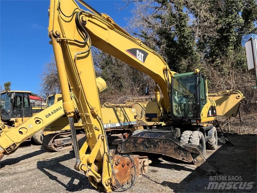 CAT M318C Pelle sur pneus