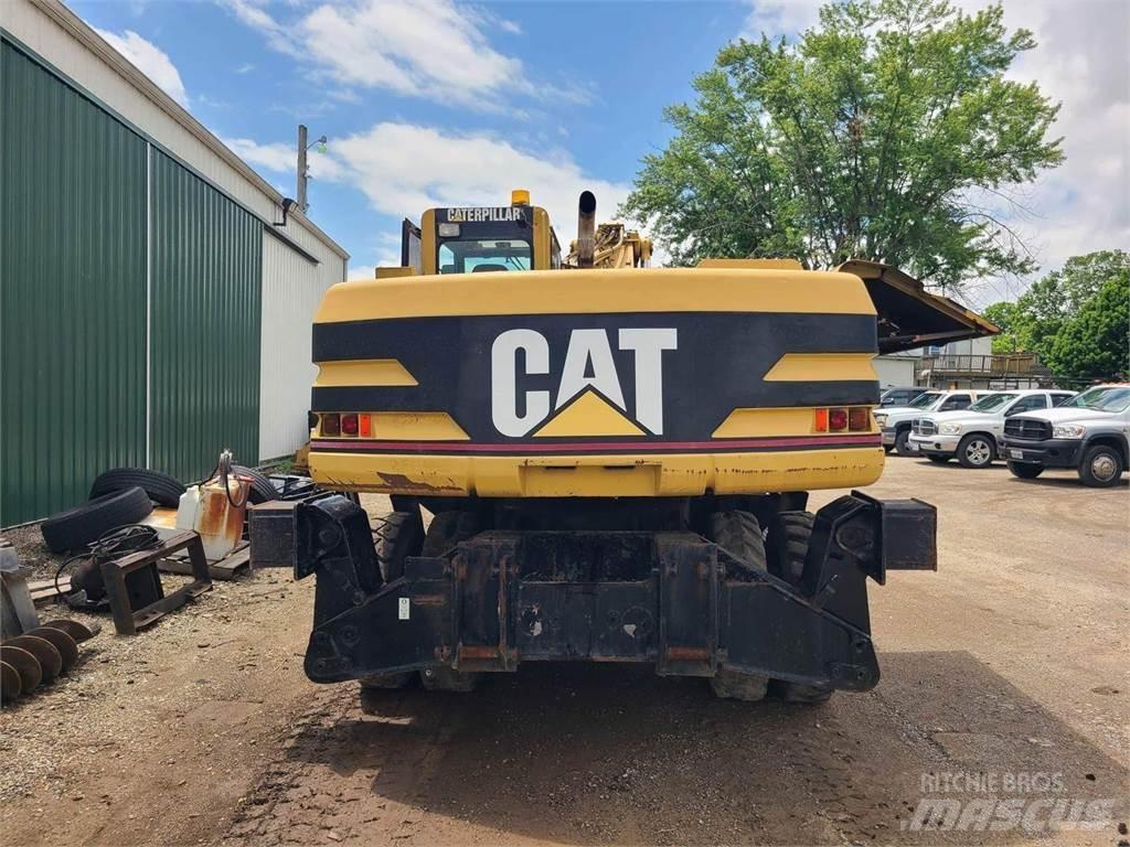 CAT M320 Pelle sur pneus