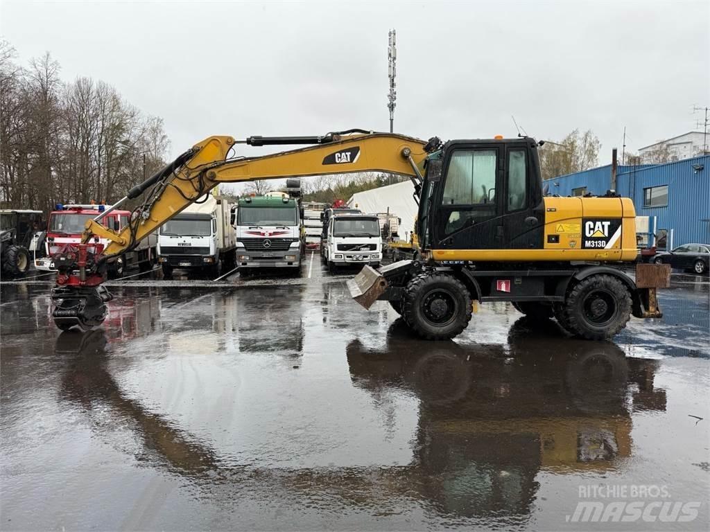 CAT M313 D Pelle sur pneus