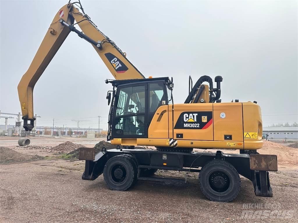 CAT MH3022 Pelle sur pneus