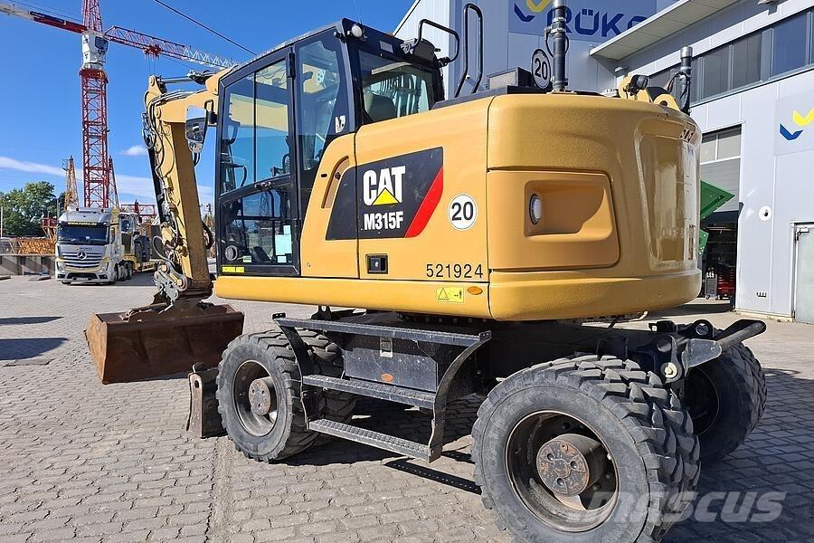 CAT M 315 F Pelle sur pneus
