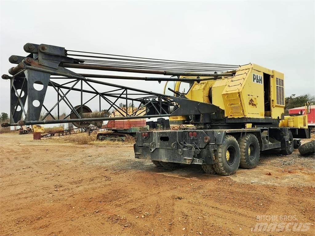 P&H 650 Camion plateau ridelle avec grue